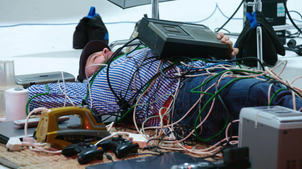 close up side shot of DJ Downsy with electricals photo by Gregg Segal